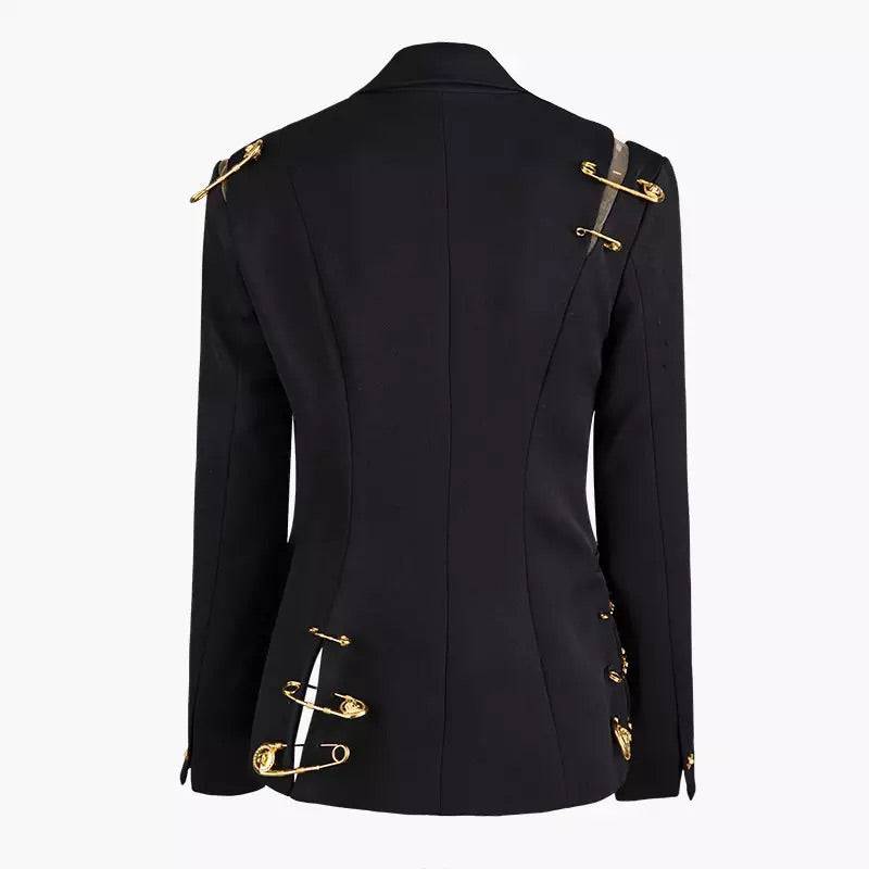 Black blazer with gold safety pin embellishments.