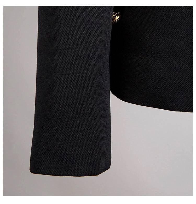 Black blazer with gold safety pin embellishments.