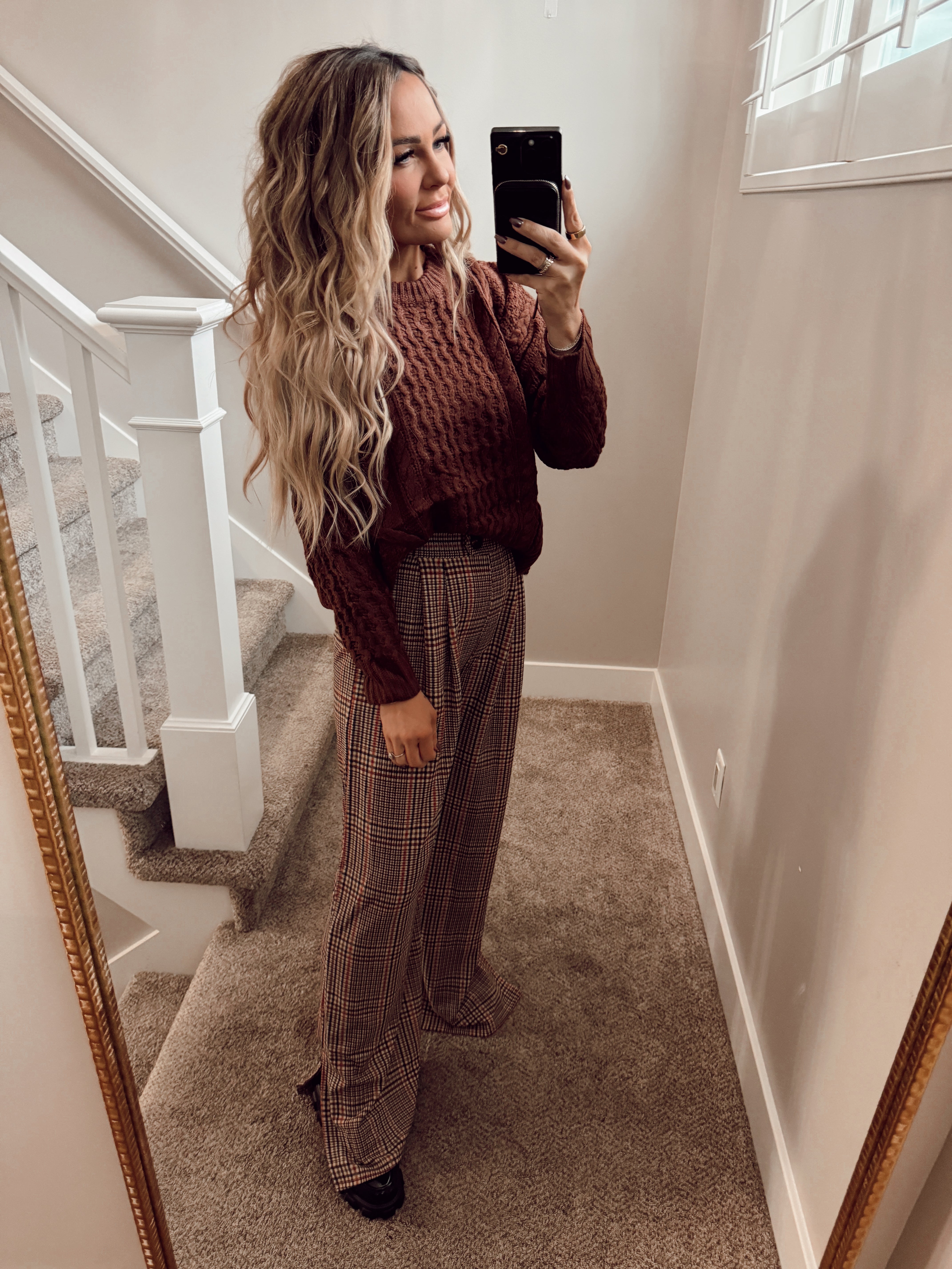 Maroon knit top.